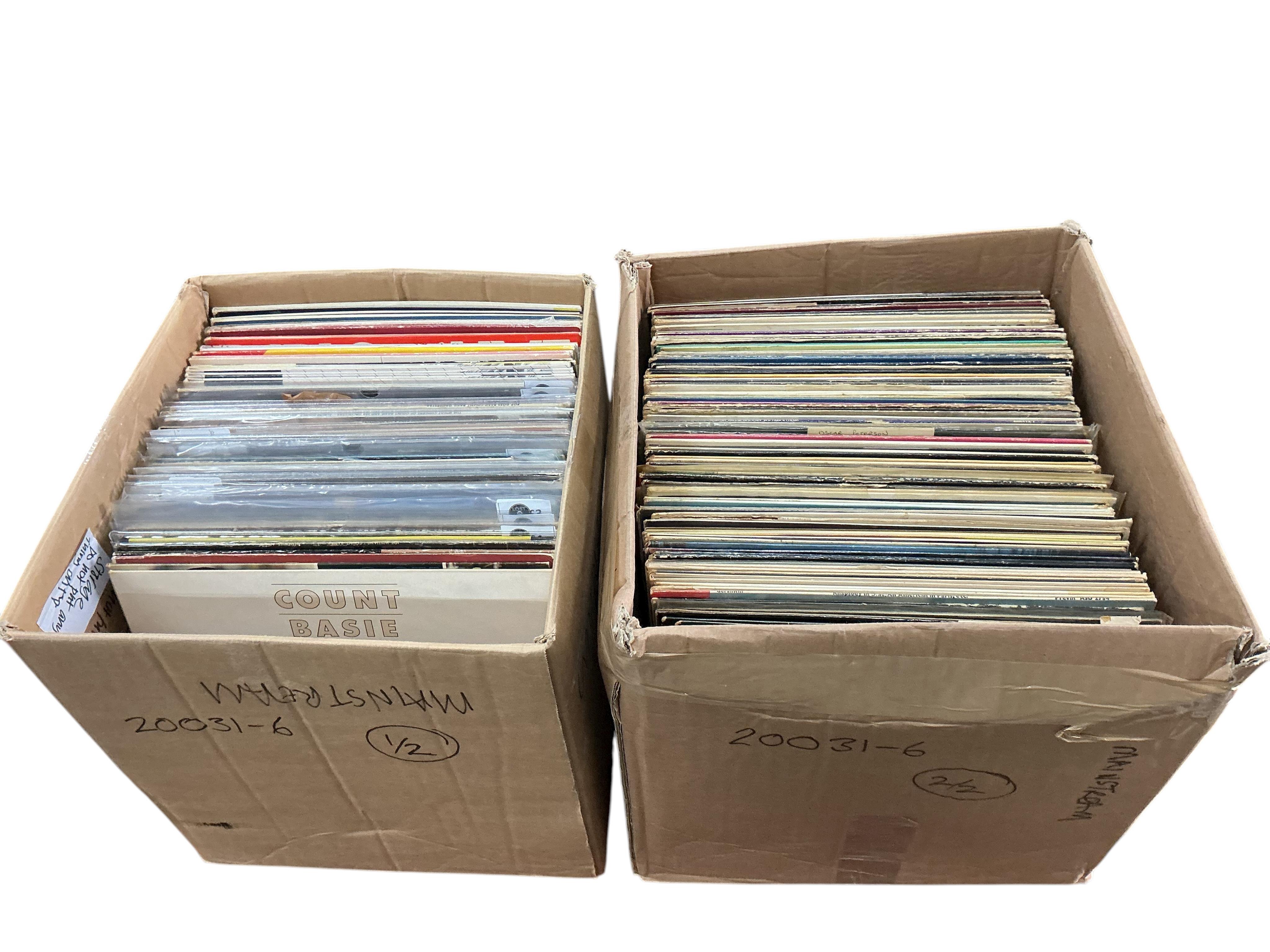 Two boxes of jazz LP record albums, artist including; Count Basie, Duke Ellington, Paul Desmond, Bessie Smith, June Christy, Oscar Peterson, Frank Sinatra, Billie Holiday, etc.